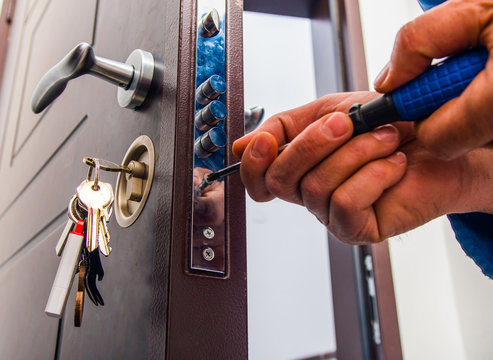 Lock repair service Ipswich - locksmith repairing door lock mechanism